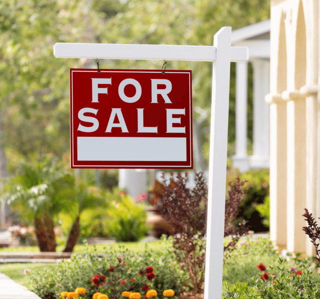 home with sale sign