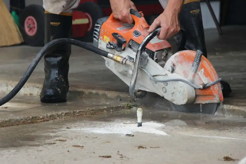 Cutting concrete for concrete leveling of a driveway