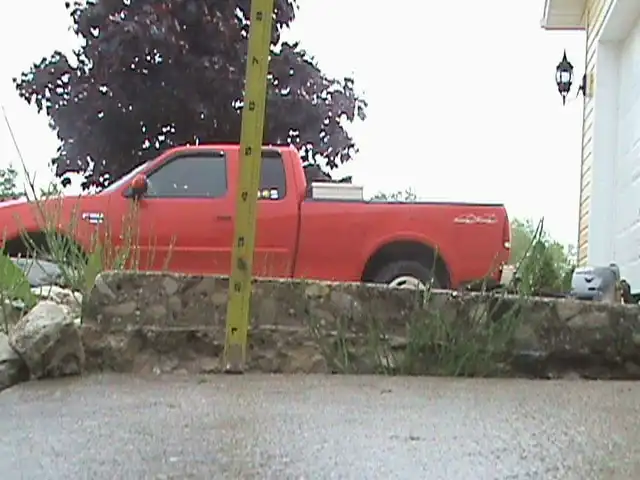 A walkway in front of a home that has settled a few inches and created a tripping hazard