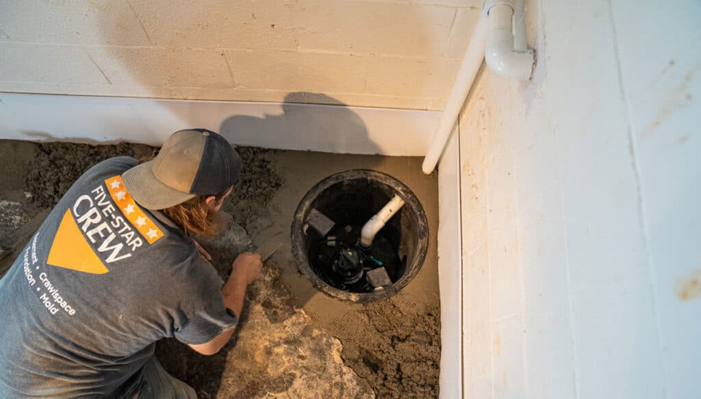 Sump pump system being finished by a Certified Foundation Specialist