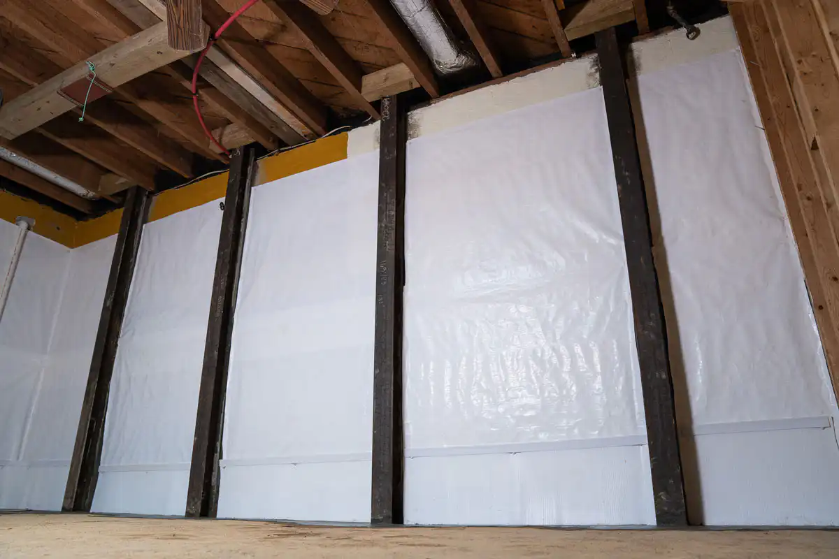 Steel I-Beams to reinforce a bowing basement wall