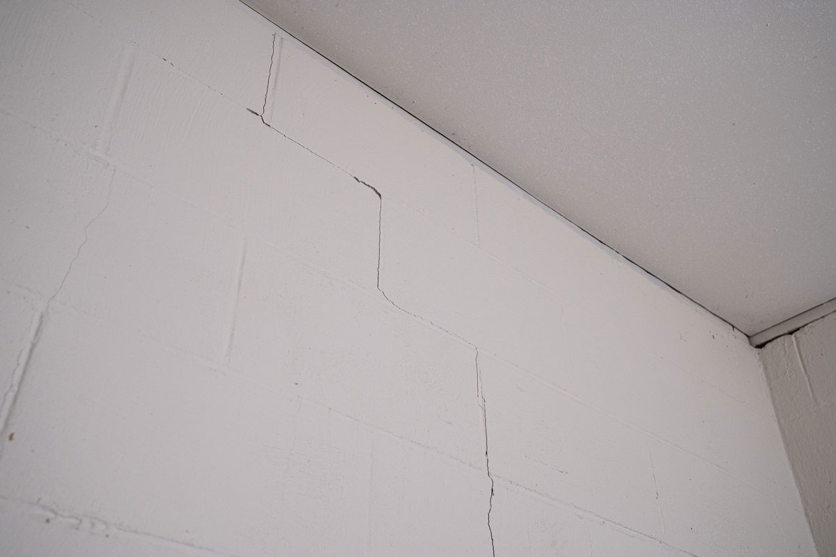 Vertical and stair-step crack in a basement wall