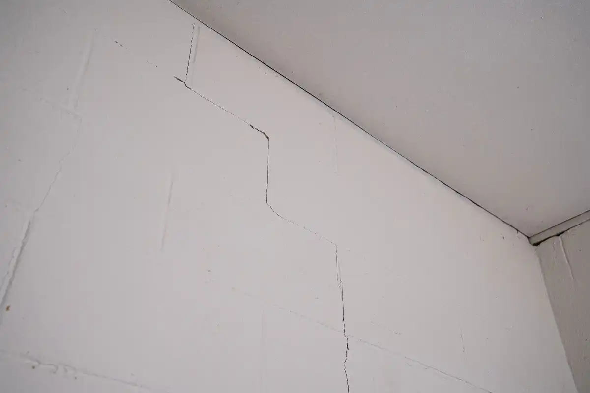 Vertical and stair-step crack in a basement wall