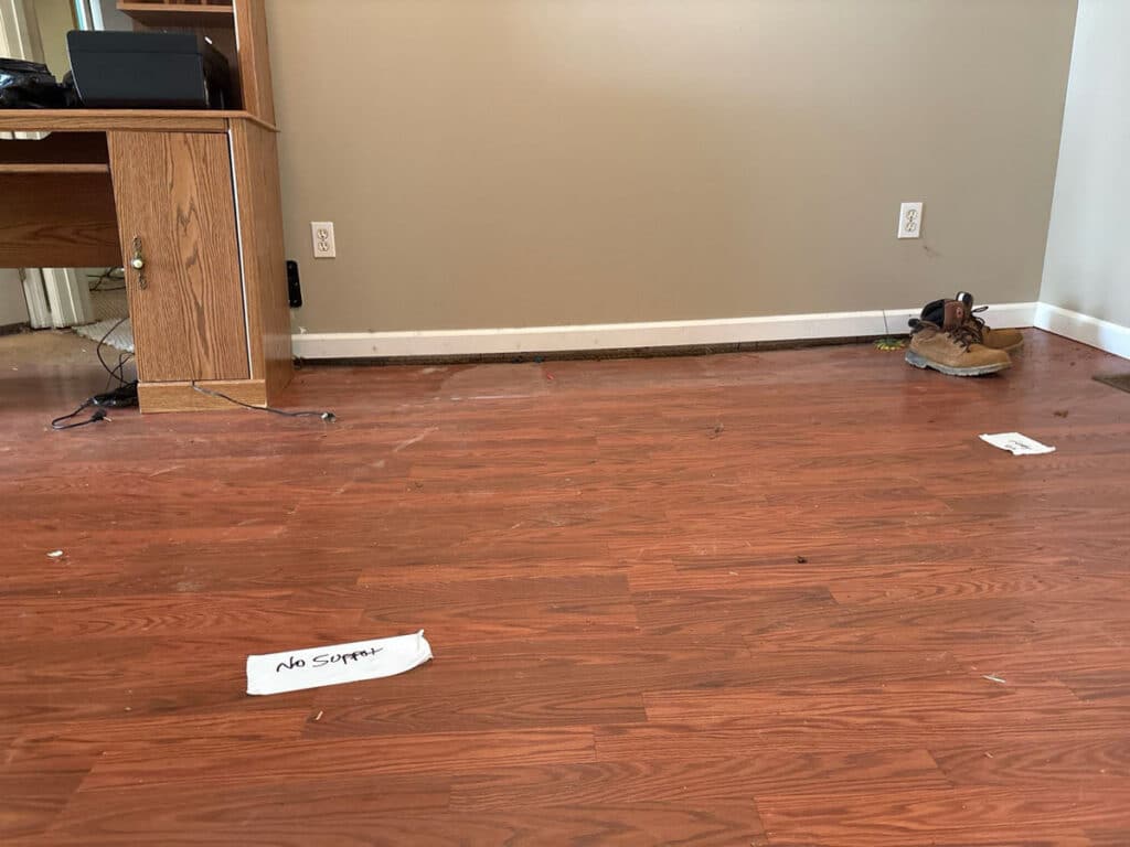 Wall and trim showing separation from the floor