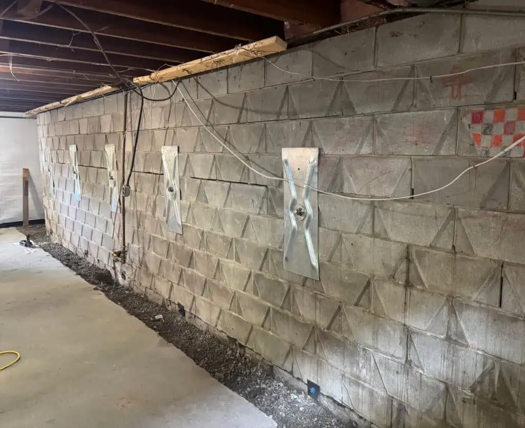 Helical anchors (tiebacks) installed in a home's basement