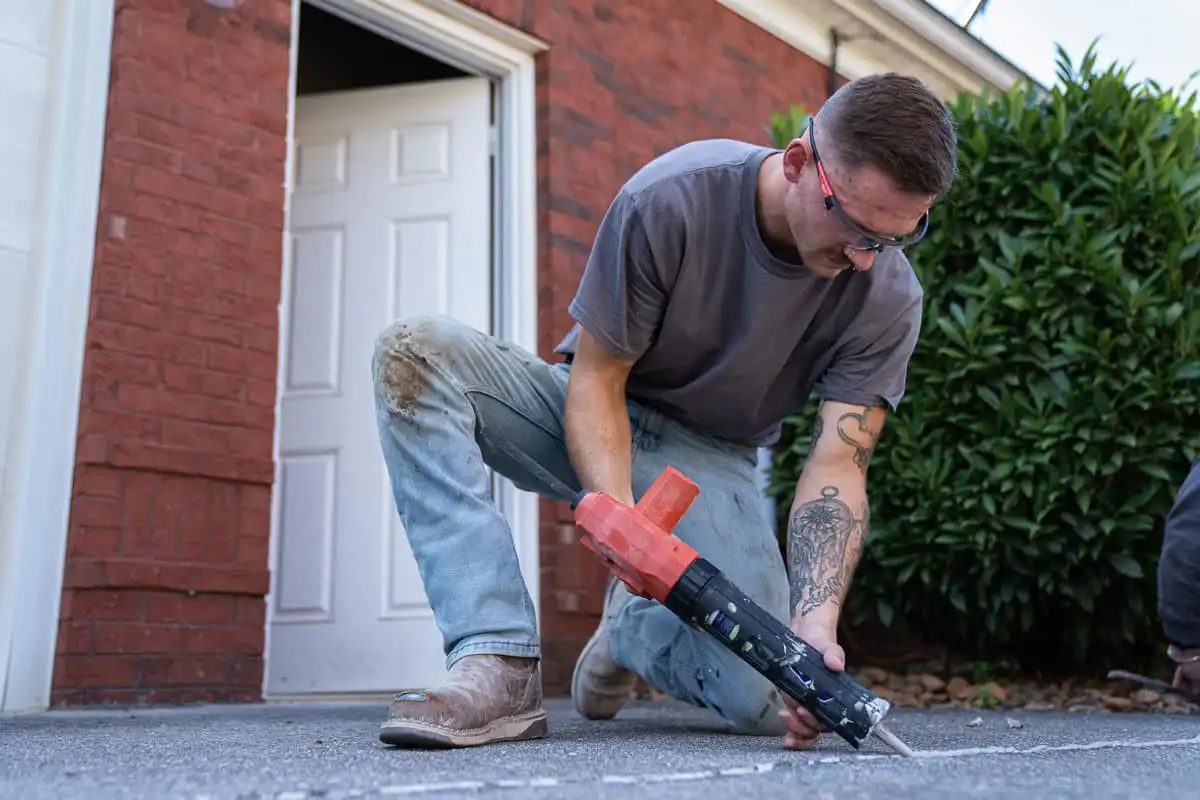 Polyurethane caulking a small driveway crack