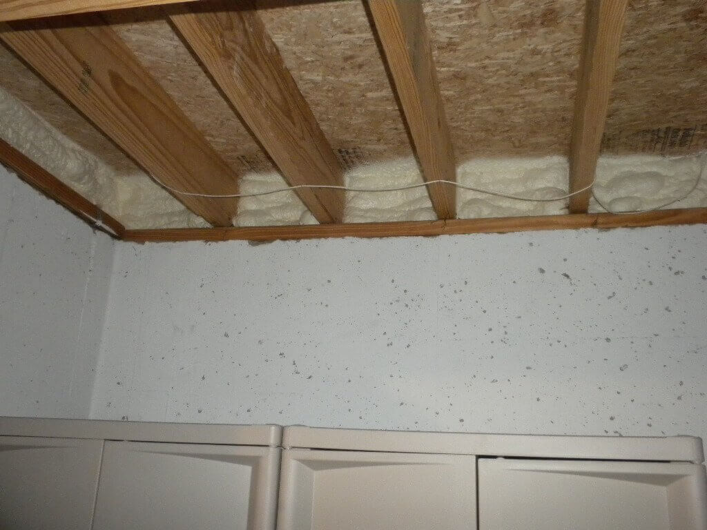 Spray foam insulation in a basement around the perimeter walls