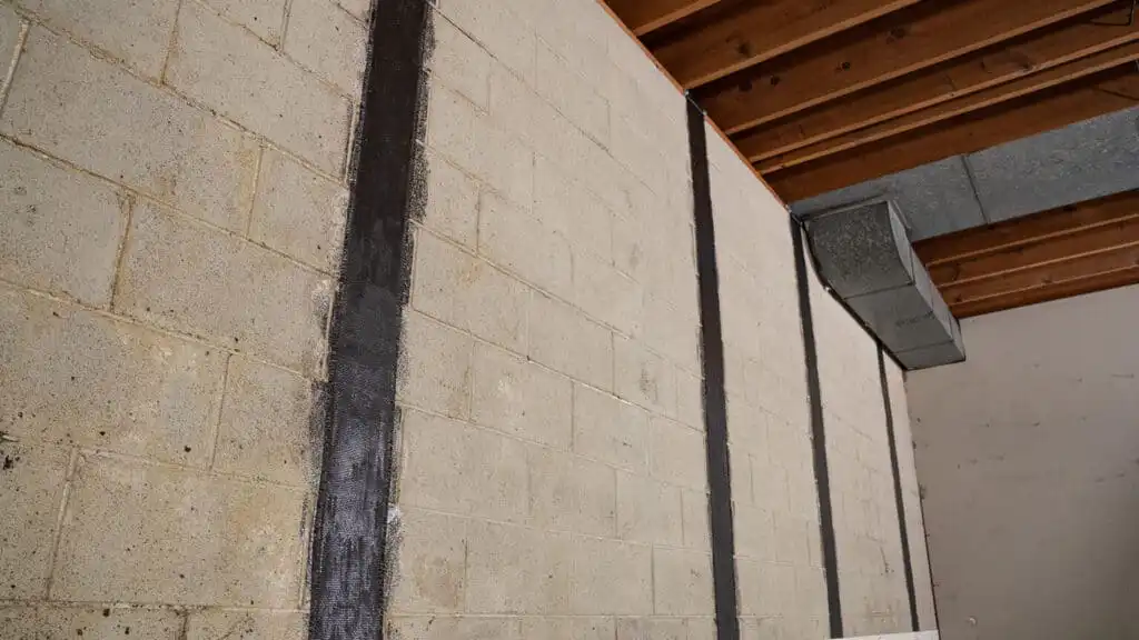 Carbon fiber wall straps installed on a basement wall