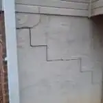 A stair-step exterior wall crack in a home's foundation