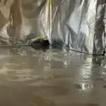 A basement with signs of flooding on the floor