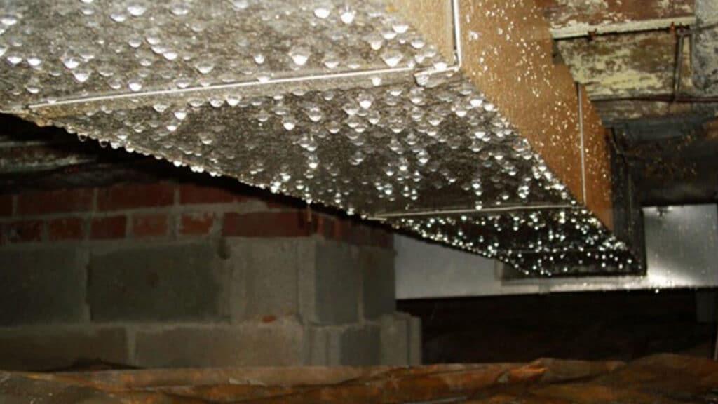 Condensation on an HVAC system in a crawl space