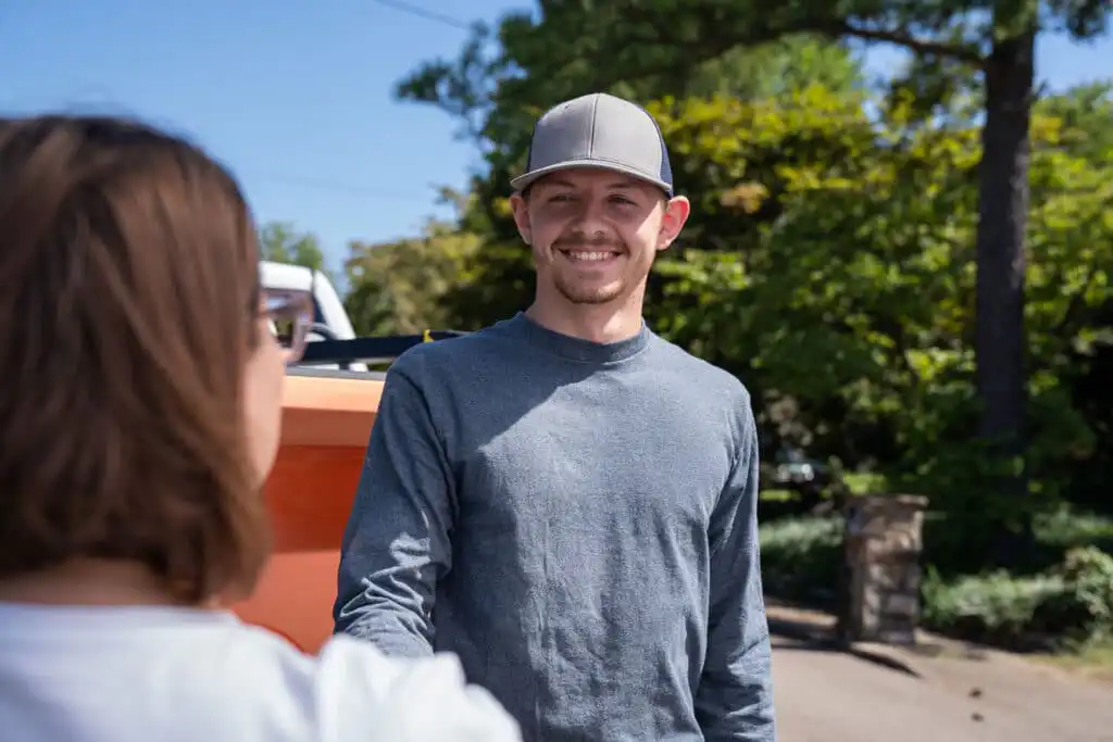 Foundation and Waterproofing Specialist shaking hands with homeowner