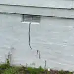 Uneven foundation settlement causing a crack on outside of home